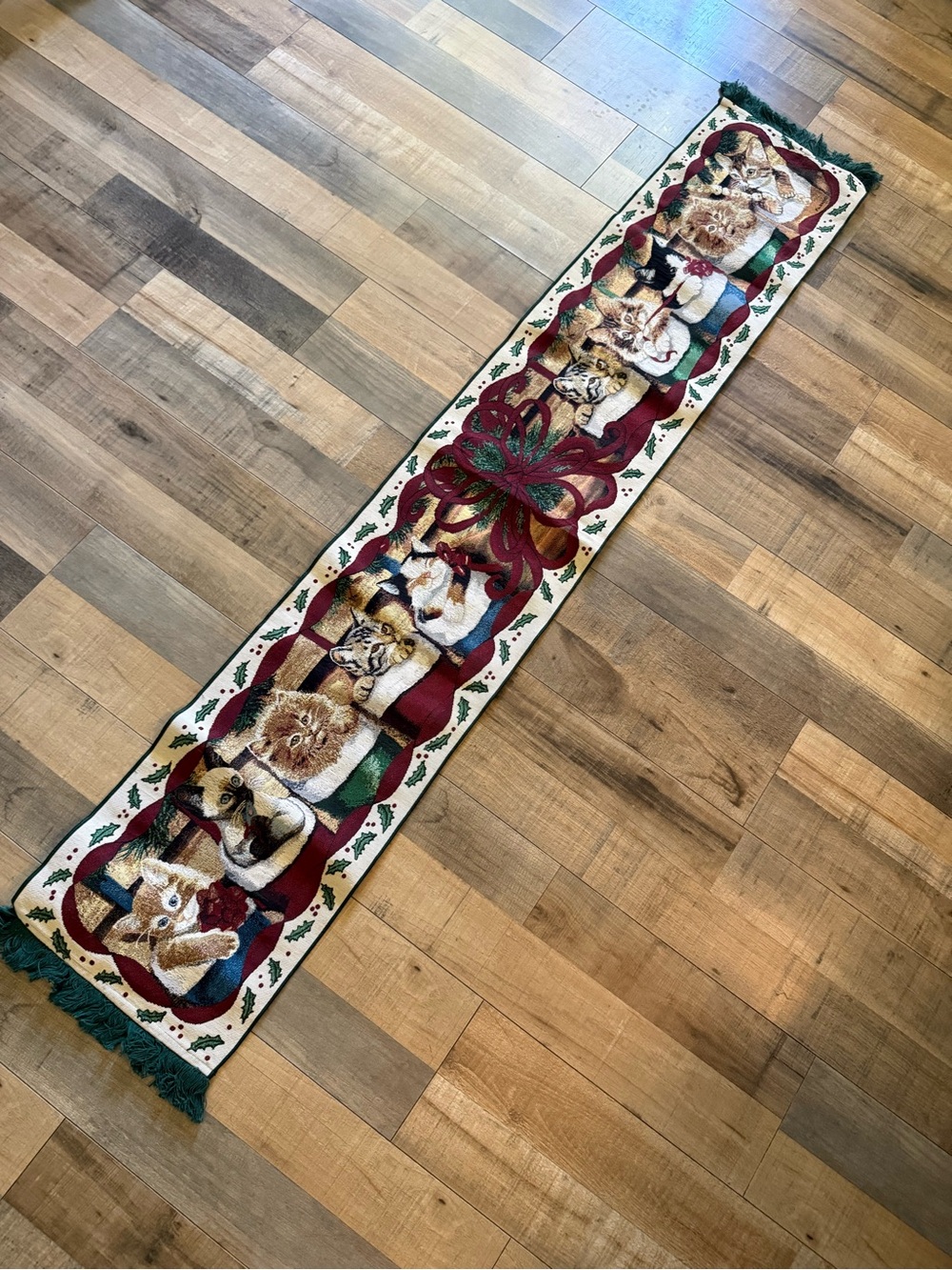 Christmas-themed tapestry table runner featuring cats in Christmas stockings.